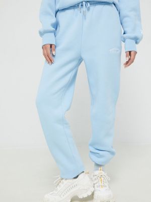Sportovní kalhoty s aplikacemi Juicy Couture modré