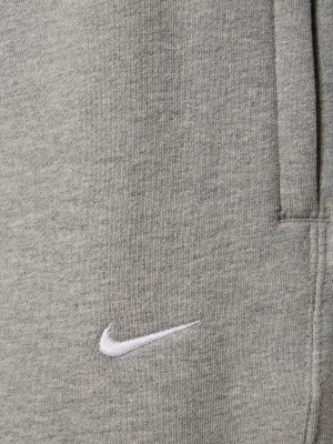 Spodnie bawełniane Nike szare