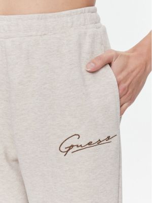 Sportovní kalhoty Guess béžové