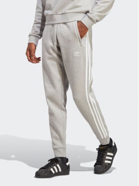Pruhované přiléhavé sportovní kalhoty Adidas šedé