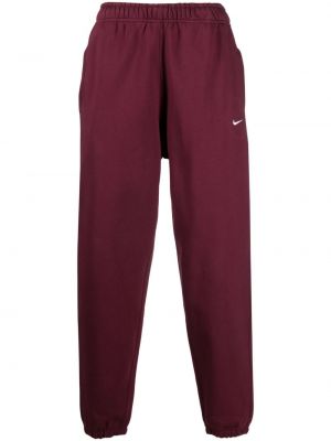 Pantaloni cu broderie Nike roșu