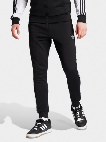 Slim fit pruhované sportovní kalhoty s aplikacemi Adidas Originals černé