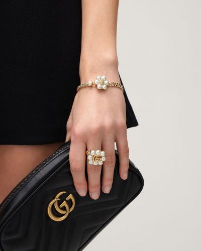 Karkötő gyöngyökkel Gucci aranyszínű