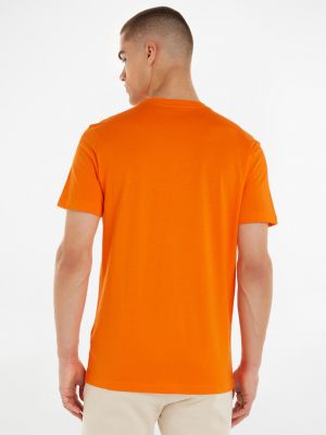 Póló Calvin Klein Jeans narancsszínű
