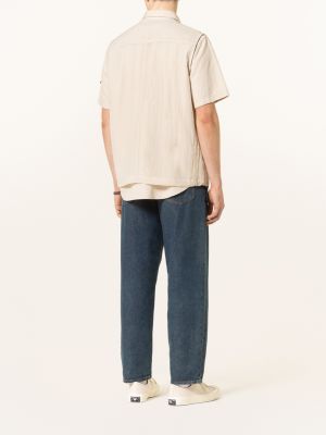 Džínová vesta se síťovinou Calvin Klein Jeans béžová