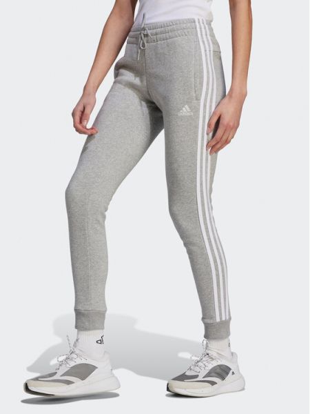 Pruhované slim fit priliehavé teplákové nohavice Adidas sivá