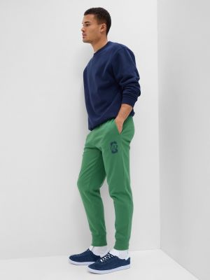 Teplákové nohavice Gap zelená