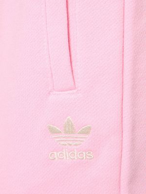 Spodnie sportowe w paski Adidas Originals różowe