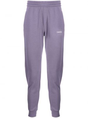 Spodnie sportowe bawełniane z nadrukiem Calvin Klein fioletowe