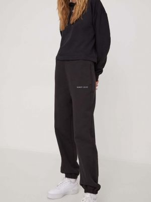 Bavlněné sportovní kalhoty s aplikacemi Tommy Jeans černé