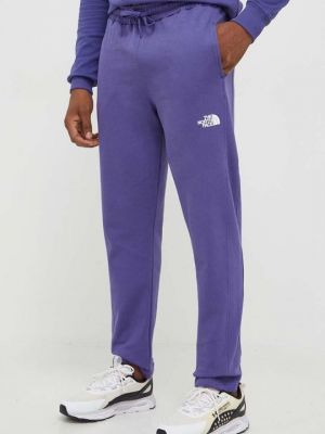 Хлопковые спортивные штаны The North Face фиолетовые