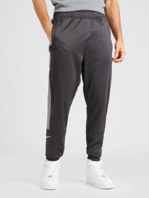 Teplákové nohavice Nike Sportswear sivá