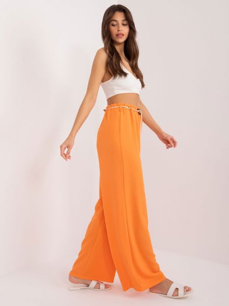 Ravne hlače Fashionhunters oranžna