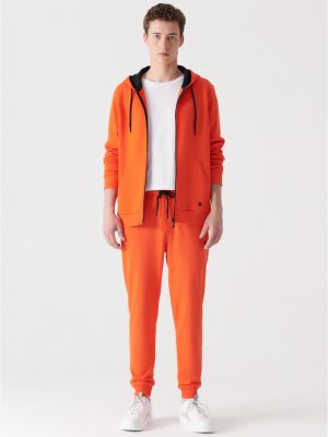 Priliehavé teplákové nohavice Avva oranžová