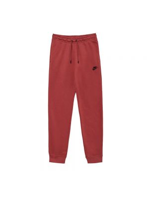 Dzianinowe spodnie sportowe w jednolitym kolorze Nike czerwone