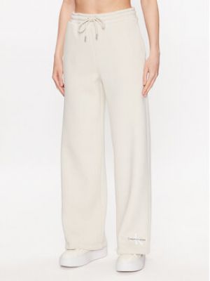 Voľné priliehavé teplákové nohavice Calvin Klein Jeans béžová