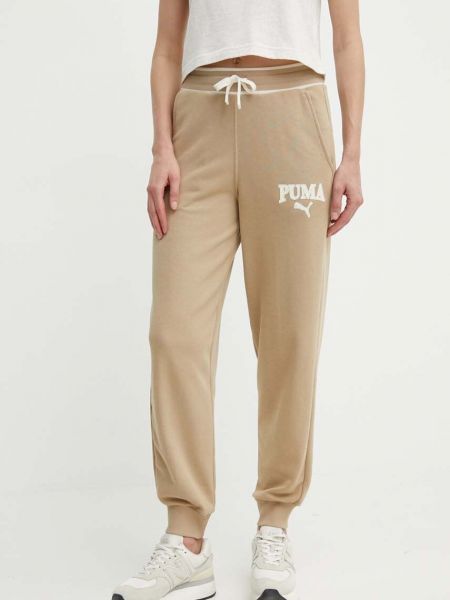 Beżowe spodnie sportowe z nadrukiem Puma