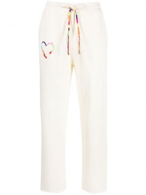 Bavlnené teplákové nohavice s výšivkou Mira Mikati biela