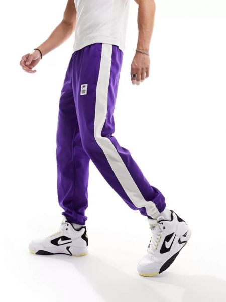 Флисовые джоггеры Nike фиолетовые