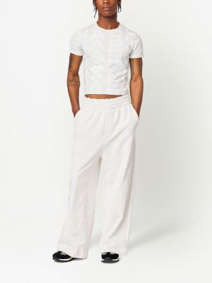 Sportovní kalhoty relaxed fit Marc Jacobs bílé