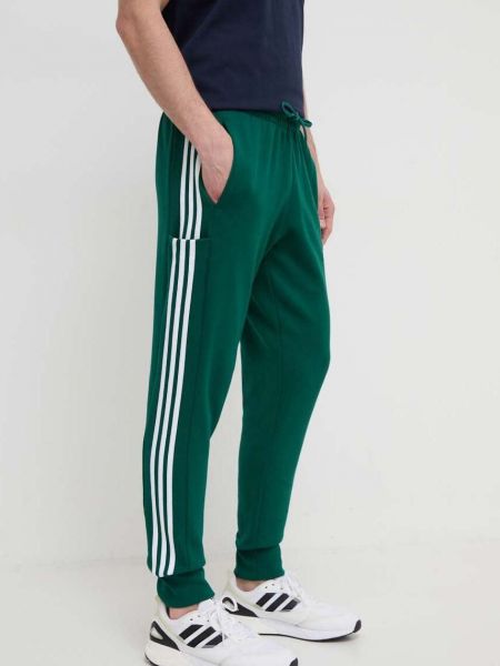 Bavlněné sportovní kalhoty s aplikacemi Adidas zelené