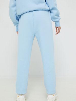 Sportovní kalhoty s aplikacemi Juicy Couture modré