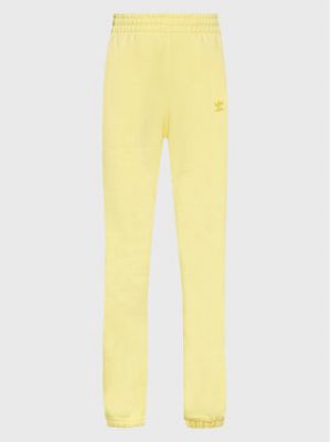 Voľné priliehavé teplákové nohavice Adidas žltá