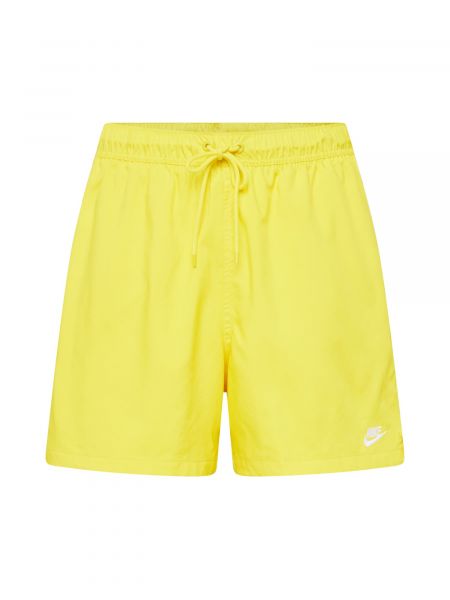 Nohavice Nike Sportswear žltá