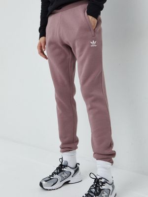 Однотонні спортивні штани Adidas Originals фіолетові