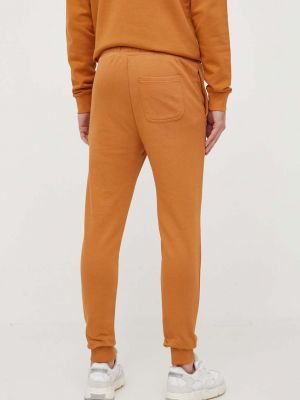 Bavlněné sportovní kalhoty Lyle And Scott oranžové