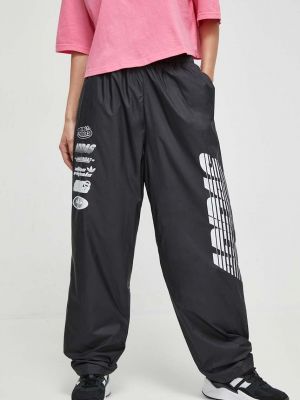 Sportovní kalhoty s potiskem Adidas Originals černé