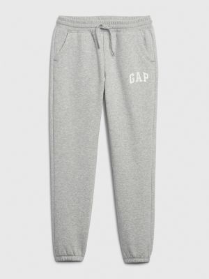 Teplákové nohavice Gap sivá