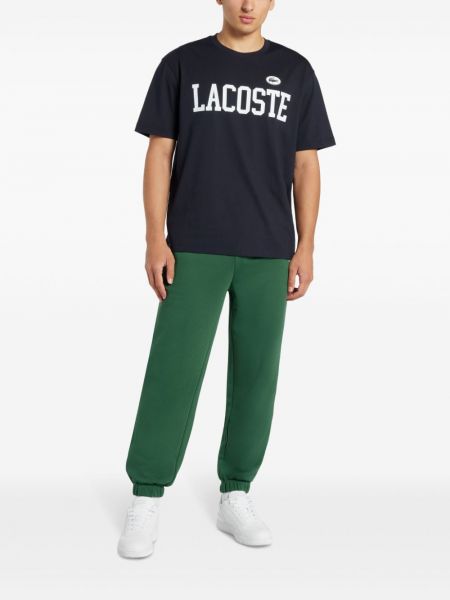 Pantalon brodé avec imprimé slogan Lacoste vert