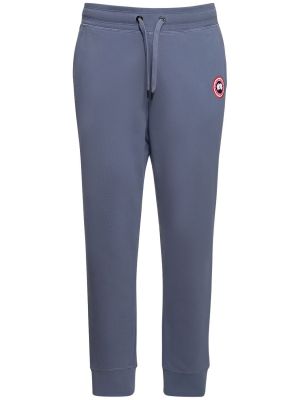 Памучни спортни панталони Canada Goose синьо