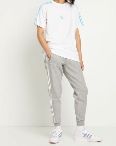 Pruhované nohavice Adidas Originals sivá