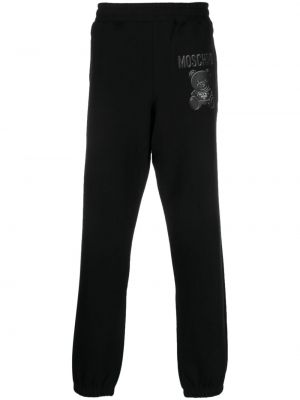Bavlněné sportovní kalhoty s potiskem Moschino černé