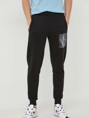 Spodnie sportowe bawełniane z nadrukiem Calvin Klein czarne