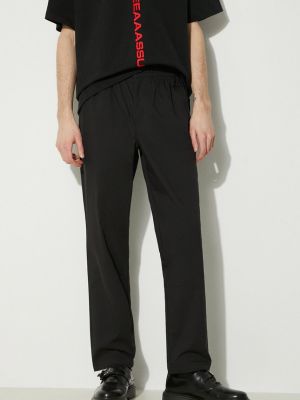 Jednobarevné rovné kalhoty New Balance černé