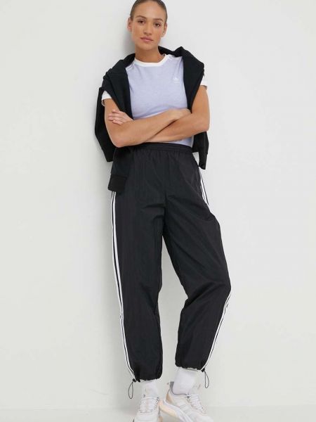 Sportovní kalhoty s aplikacemi Adidas Originals černé