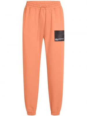 Bavlnené teplákové nohavice s potlačou Karl Lagerfeld Jeans oranžová