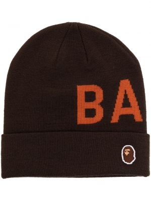 Mössa i stickad A Bathing Ape® brun