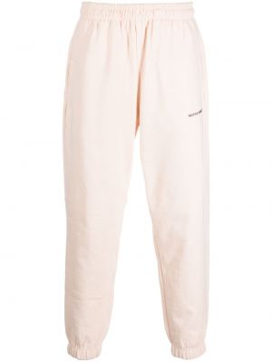 Spodnie sportowe bawełniane w jednolitym kolorze z nadrukiem Monochrome beżowe