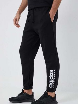 Sportovní kalhoty s potiskem Adidas černé