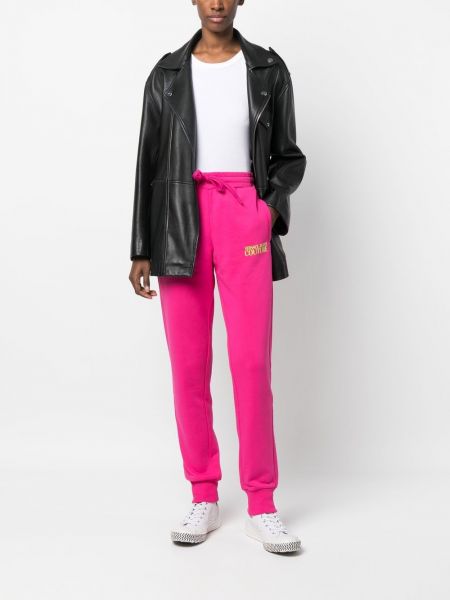 Kokvilnas treniņtērpa bikses ar apdruku Versace Jeans Couture rozā