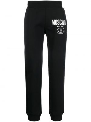 Bavlnené nohavice s potlačou Moschino čierna