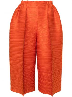 Spodnie plisowane Pleats Please Issey Miyake pomarańczowe