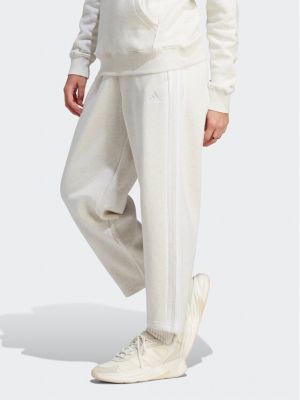 Pantaloni sport din fleece cu dungi cu croială lejeră Adidas