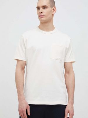 Bavlněné tričko New Balance béžová barva