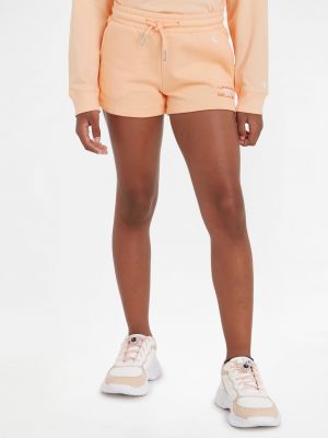 Nohavice Calvin Klein Jeans oranžová