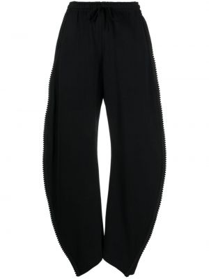 Bavlnené teplákové nohavice s výšivkou Jnby čierna